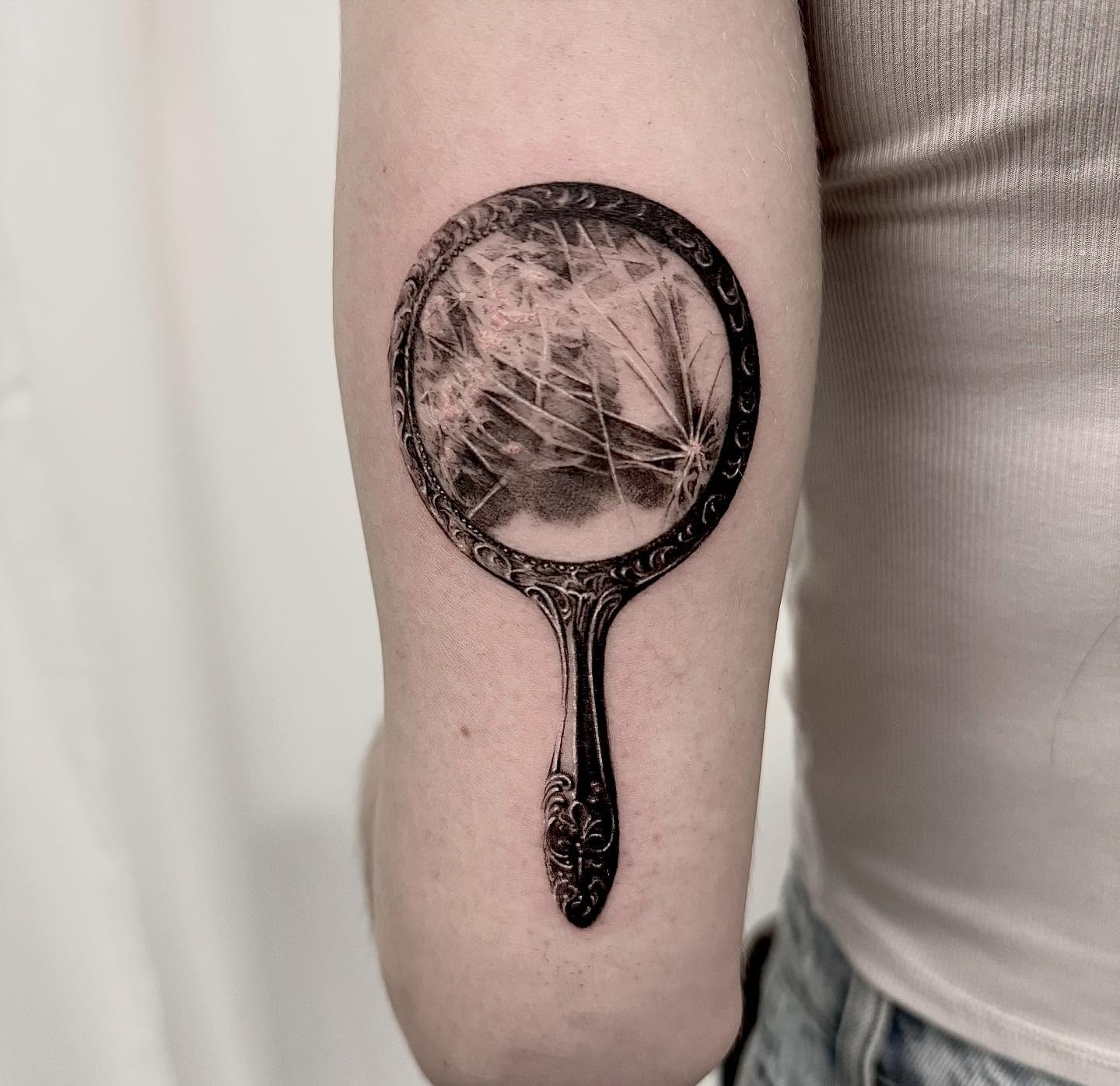 Dandelion seed head realism tattoo on the forearm by Oori