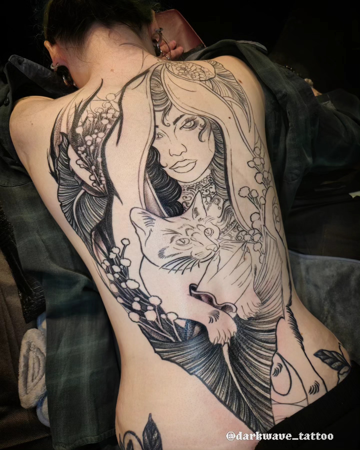 Woman with cat realism tattoo on the back by Barrett Handel