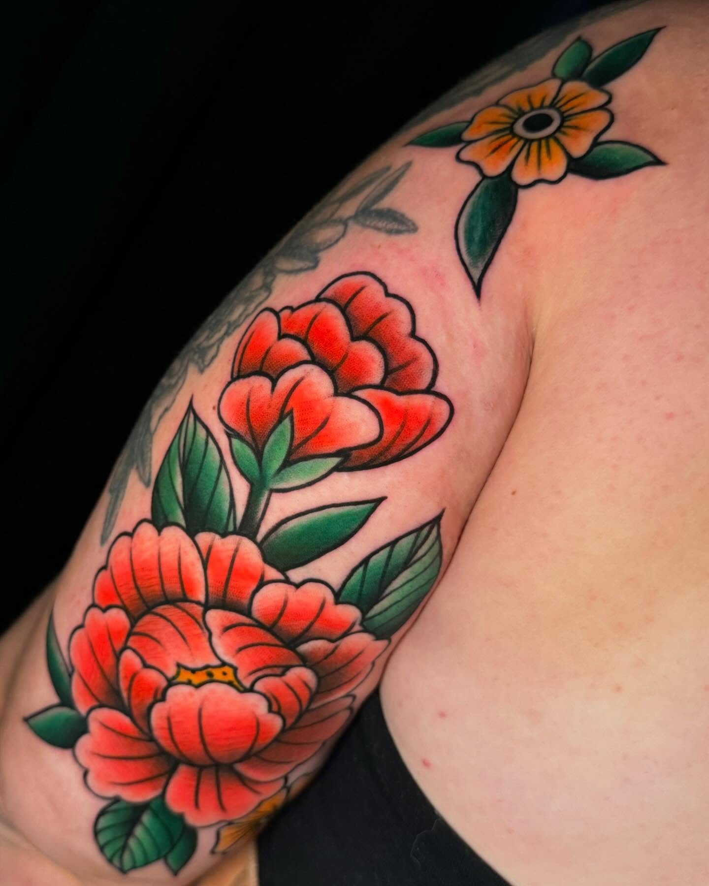Peonies American traditional tattoo on the shoulder by Amber