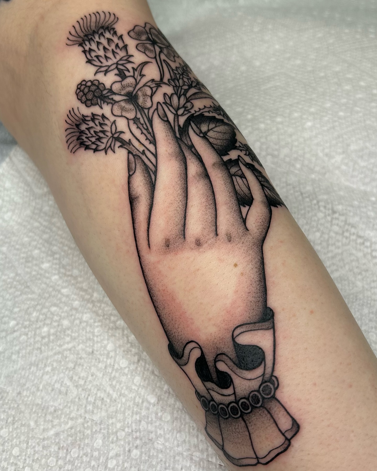 Praying hand with flowers black and grey tattoo on the forearm by ☻ darby robertson ☻