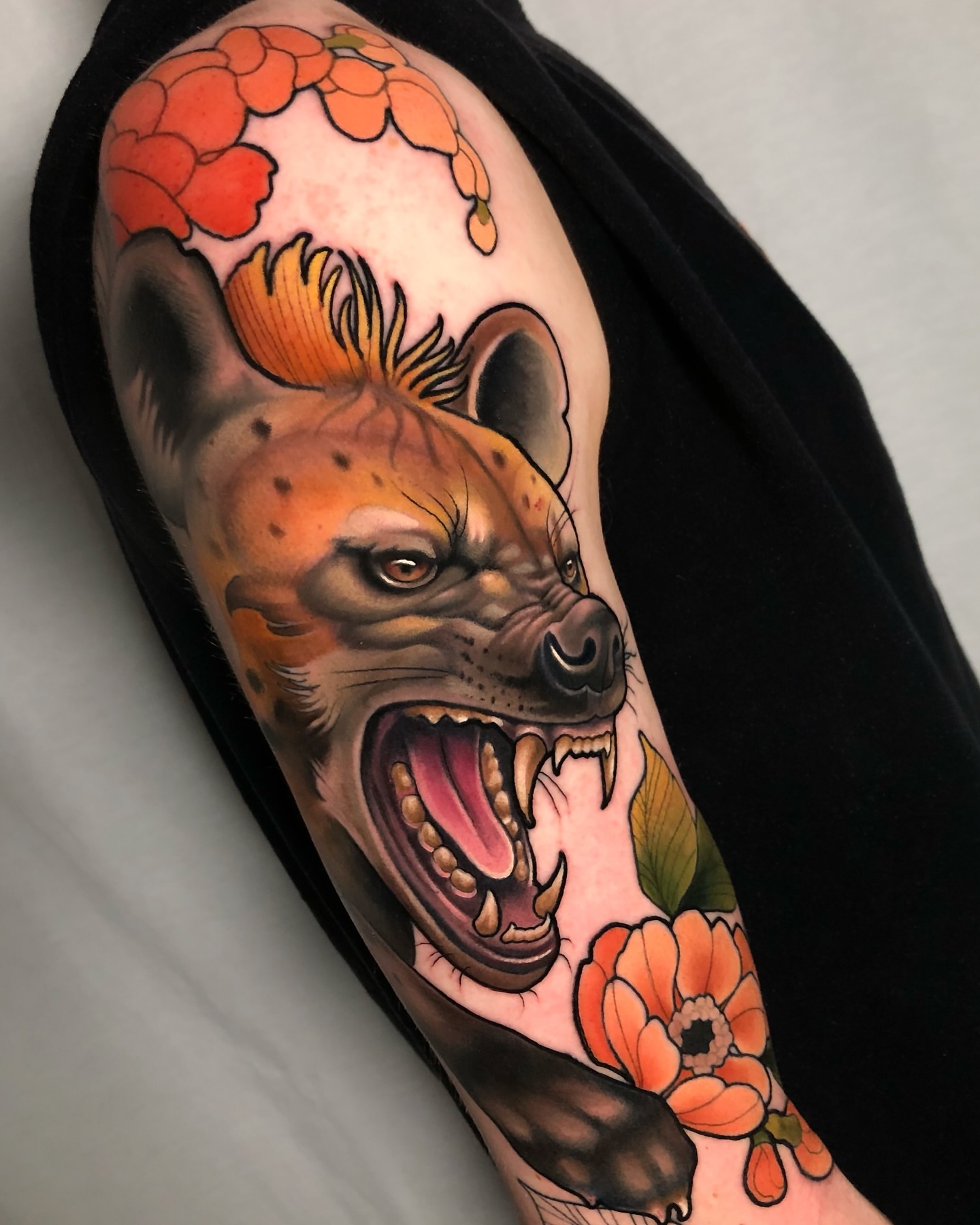 Hyena head realism tattoo on the forearm by Milo Alfring Tattoo