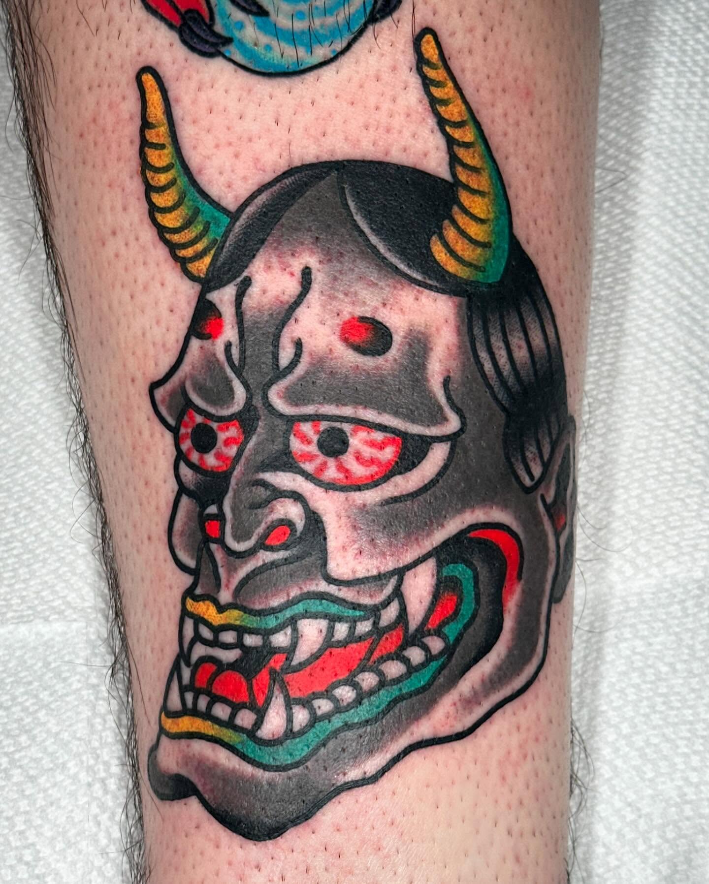 Demon mask American traditional tattoo on the forearm by Steve Pearson