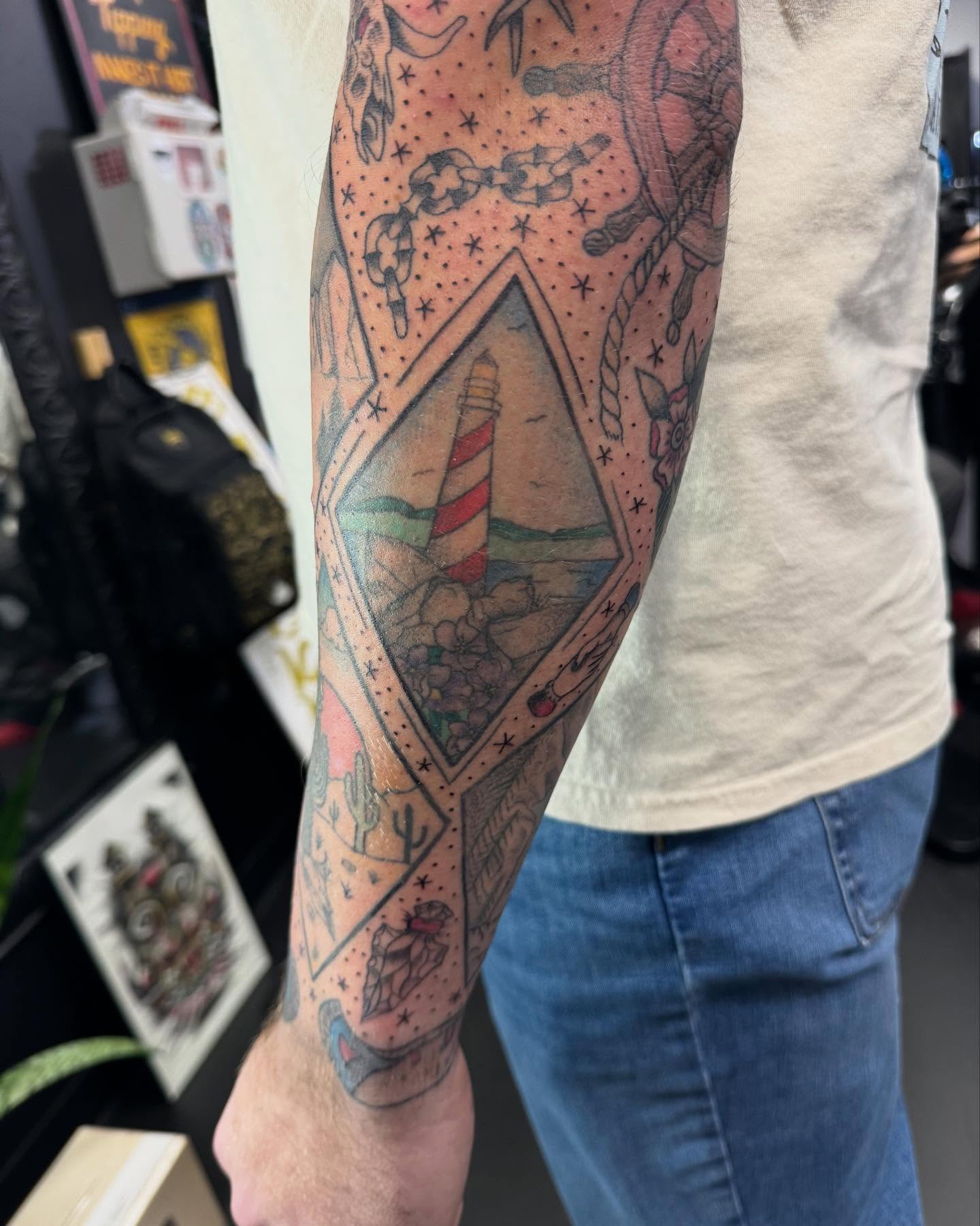Lighthouse American traditional tattoo on the forearm by Marissa Losier