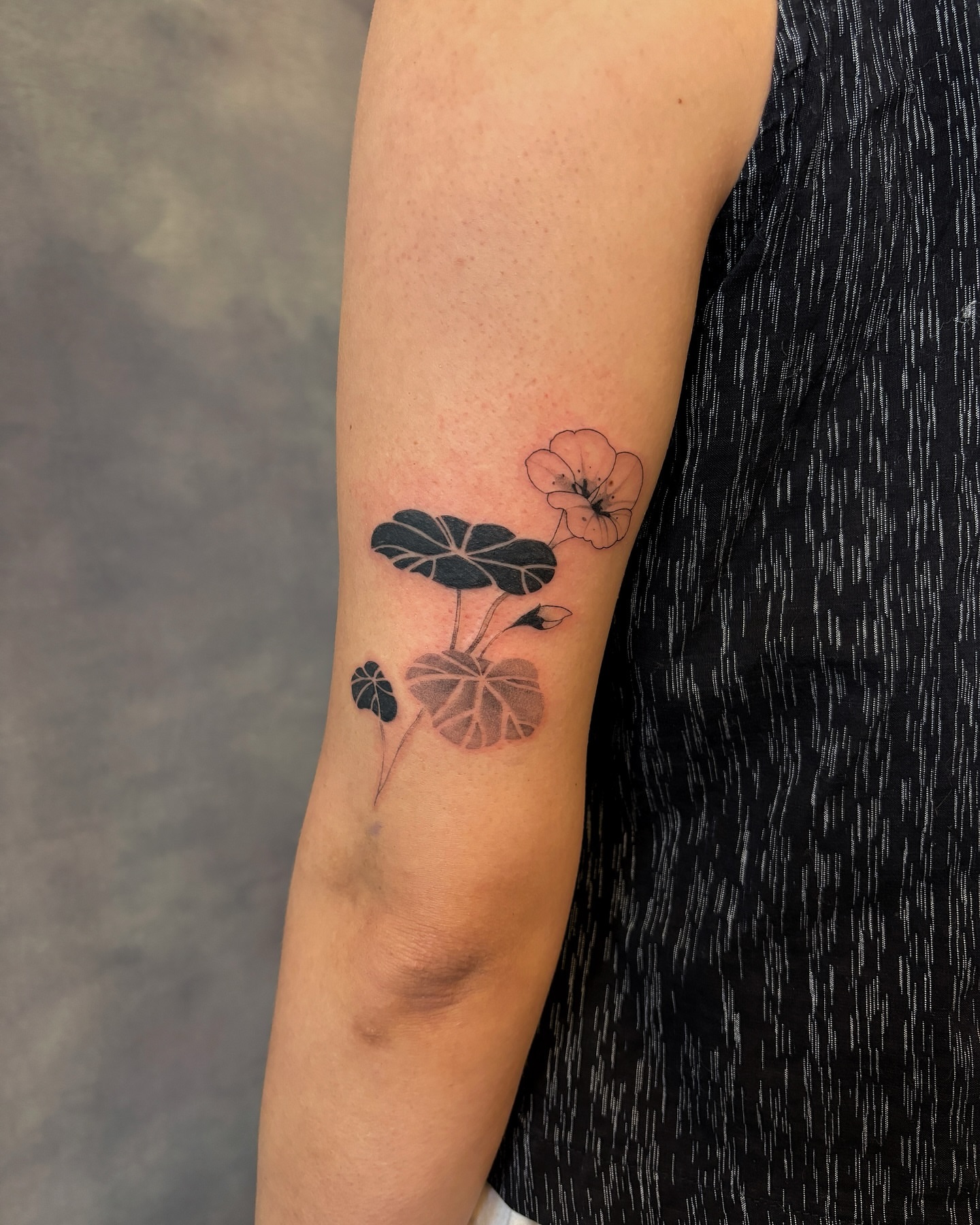Lotus flower black and grey tattoo on the forearm by sago, Berkeley, California