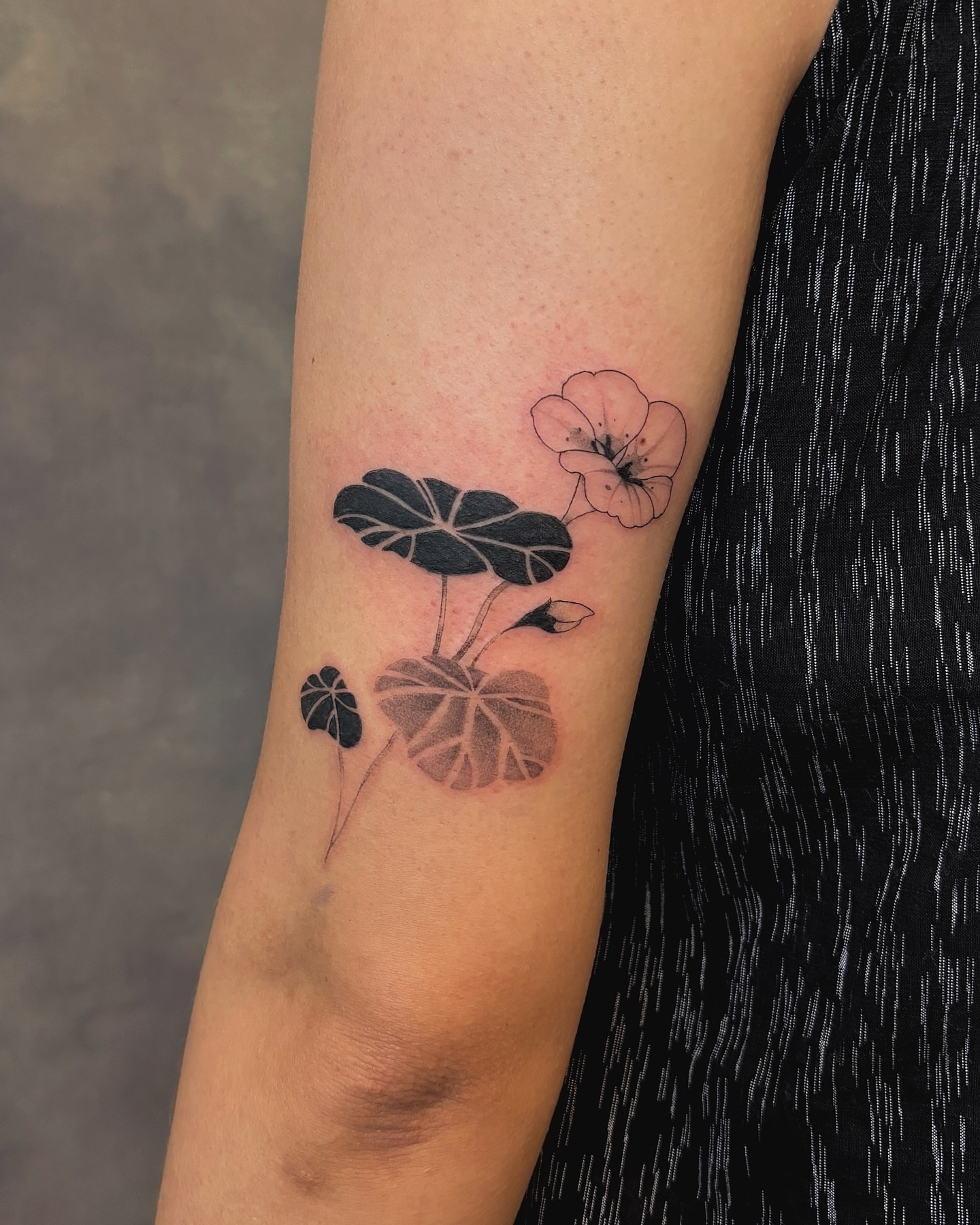 Lotus flower black and grey tattoo on the forearm by sago, Berkeley, California