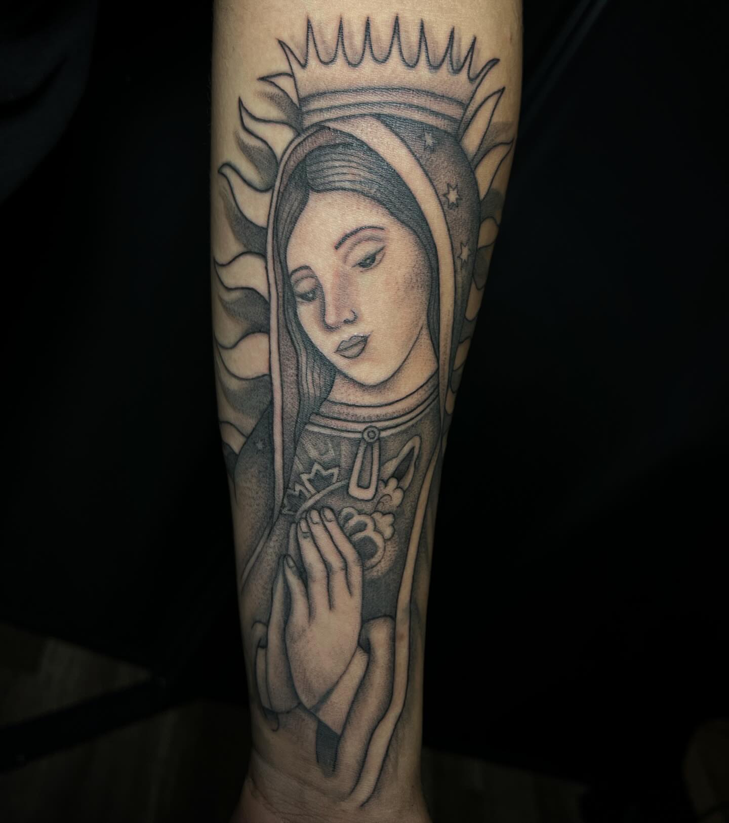 Religious figure black and grey tattoo on the forearm by Iraymi Beltran