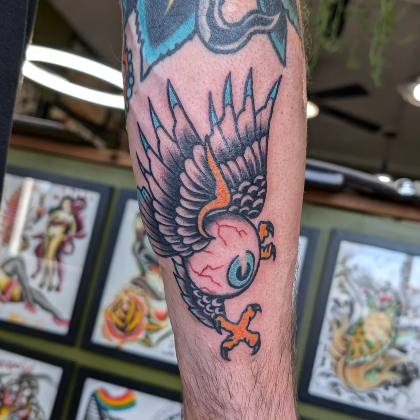 Eye with wings American traditional tattoo on the forearm by Jamie Yuu, Minneapolis, Minnesota
