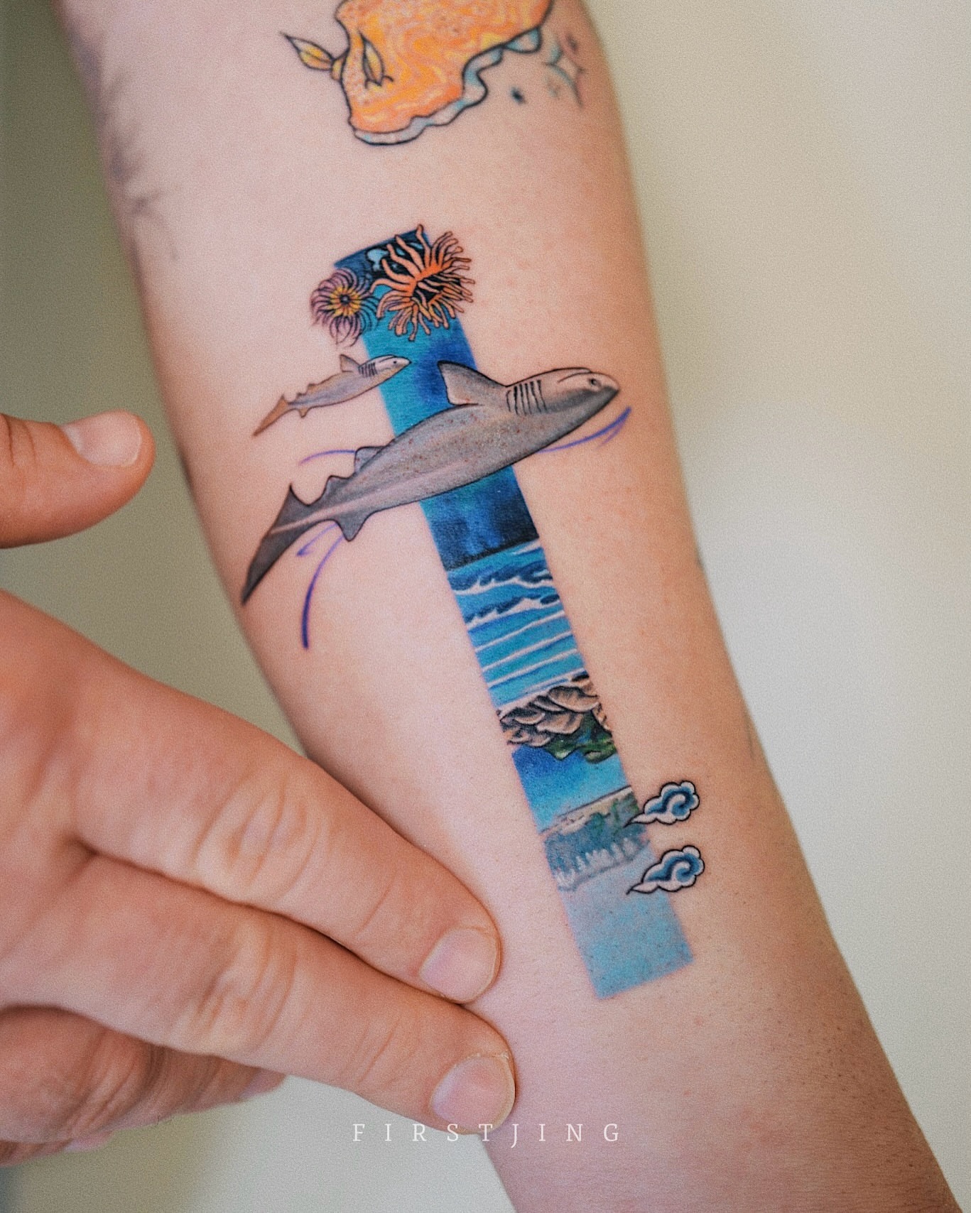 Shark and ocean new school tattoo on the forearm by Seattle