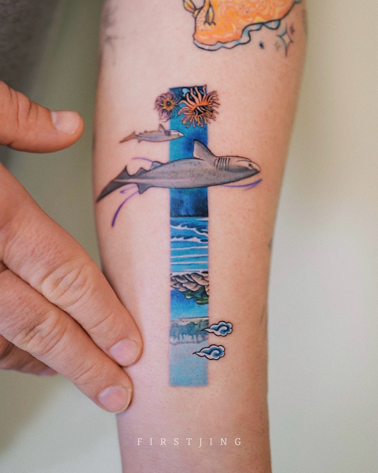 Shark and cross new school tattoo on the forearm by Seattle