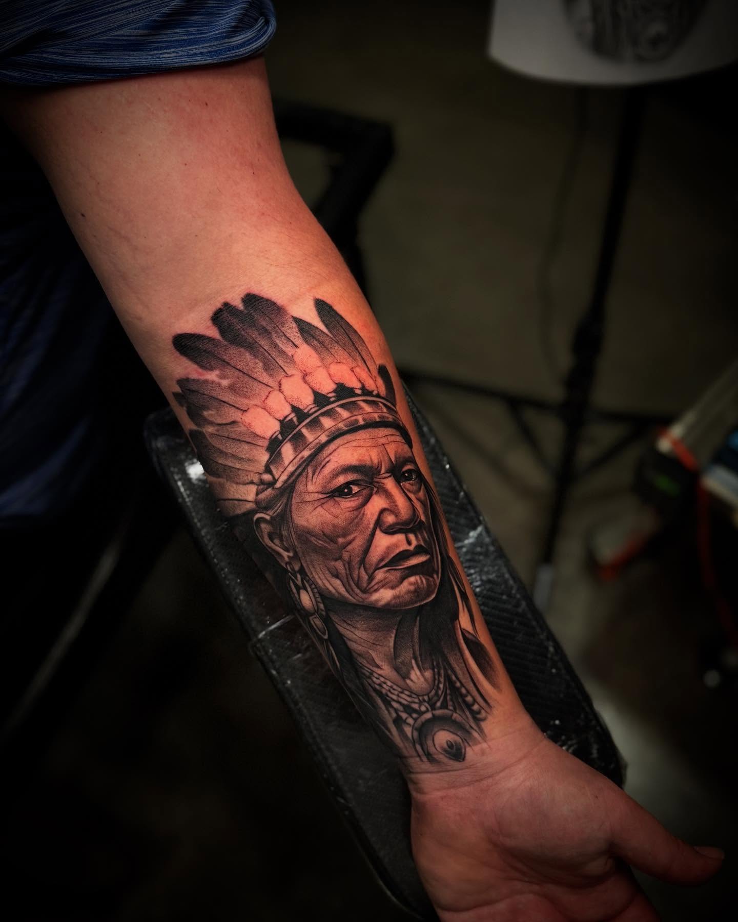 Indian chief realism tattoo on the forearm by Carlos Lujan