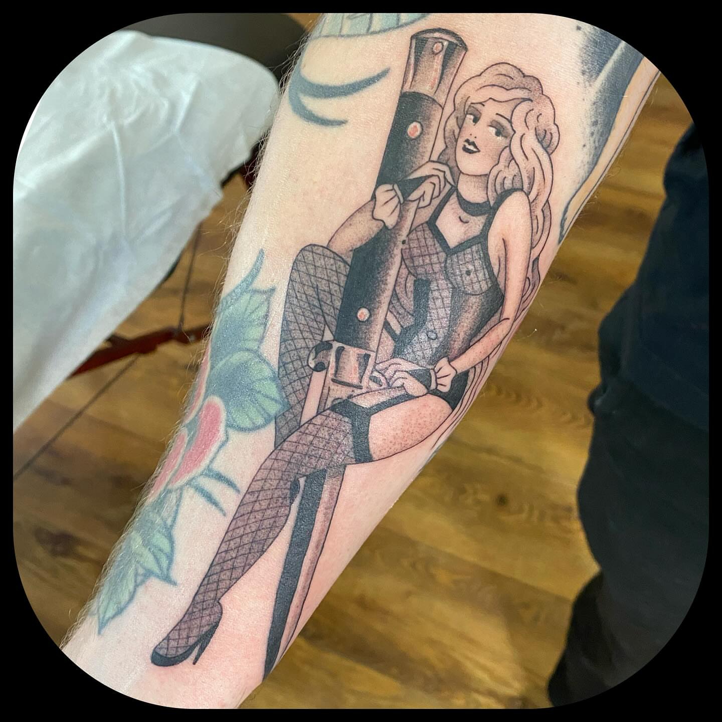 Pin-up girl with gun American traditional tattoo on the forearm by ๐ญ๐๐ ๐ฎ๐๐๐๐๐, Berkeley, California