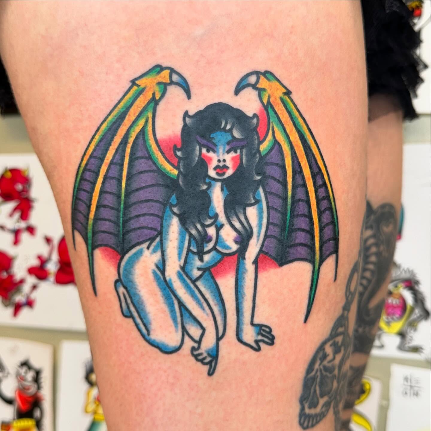 Winged woman American traditional tattoo on the thigh by Keon Ostby, Tempe, Arizona