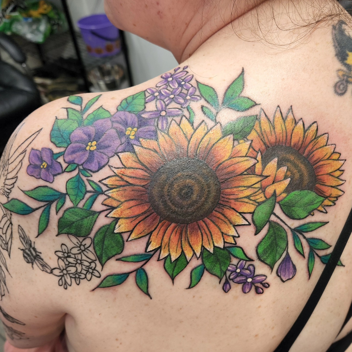 Sunflowers and flowers realism tattoo on the shoulder by Samantha Von Zombia, Saint Paul, Minnesota