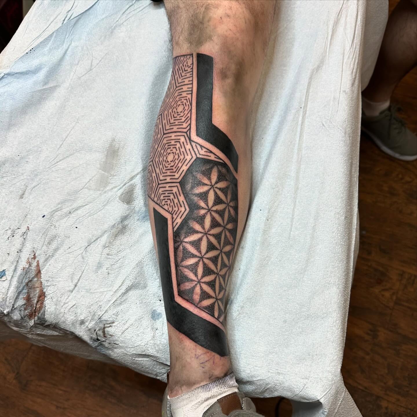 Geometric pattern geometric tattoo on the forearm by Jackie