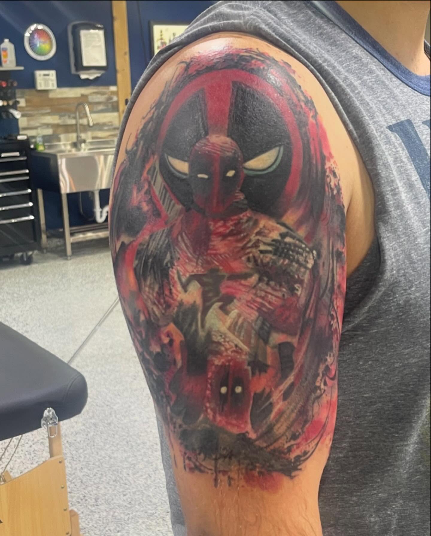 Deadpool realism tattoo on the forearm by Troy Butner