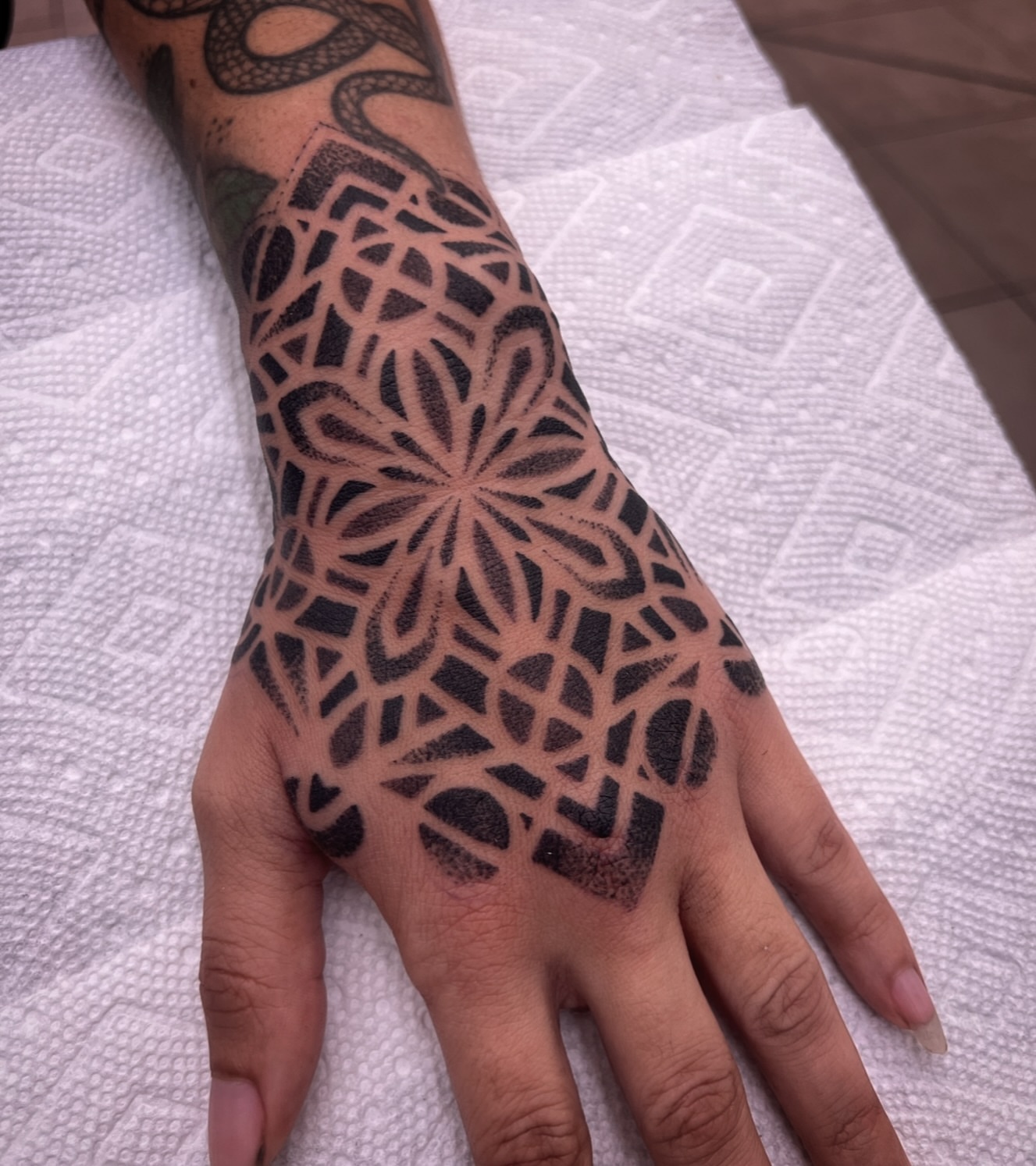 Geometric pattern geometric tattoo on the hand by Paul Schnell