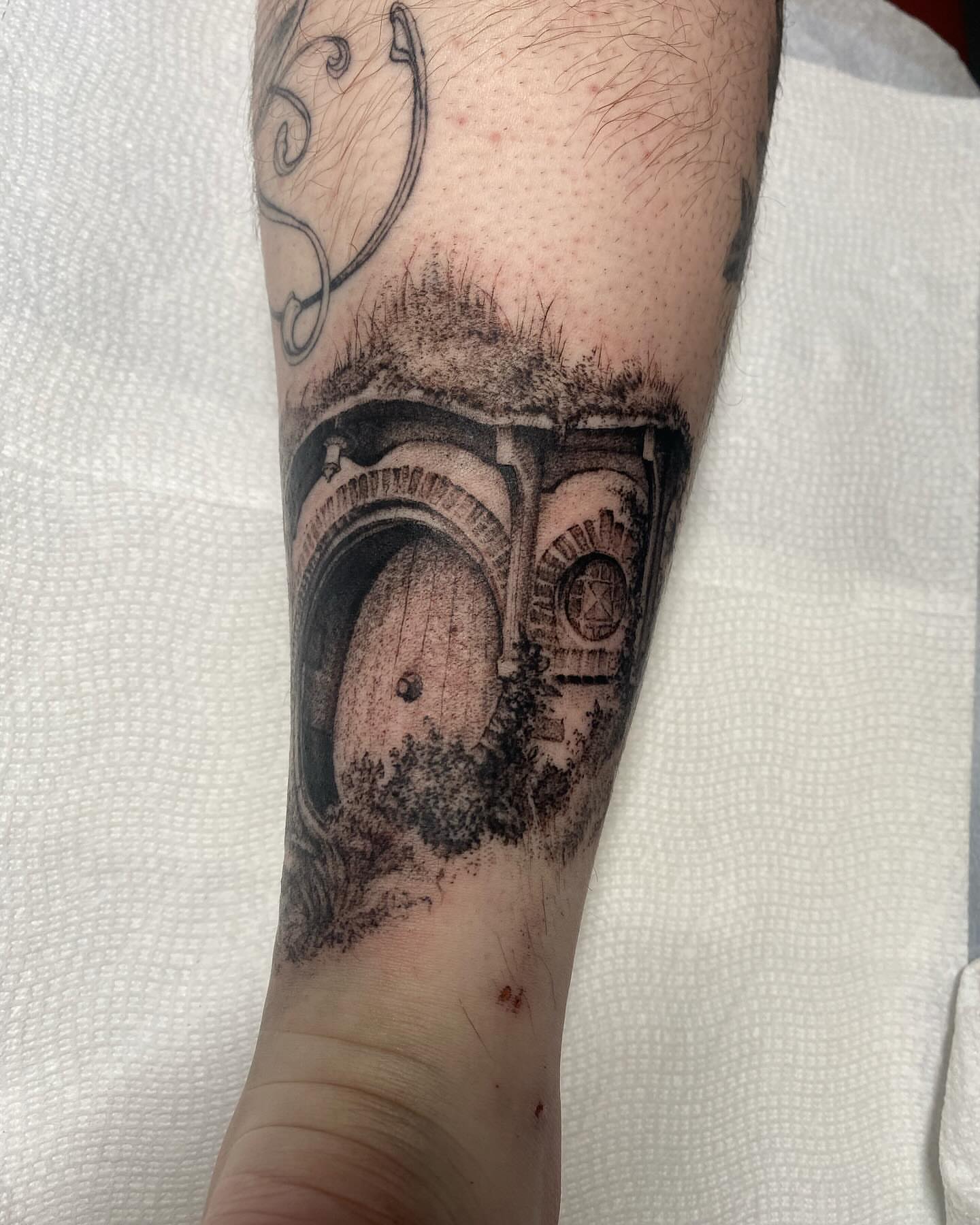 Camera realism tattoo on the forearm by Amber Miracle