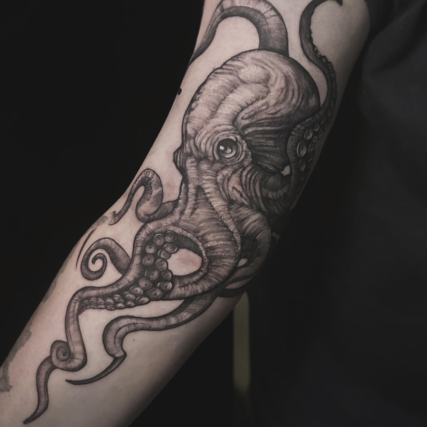 Octopus realism tattoo on the forearm by Juan Russo