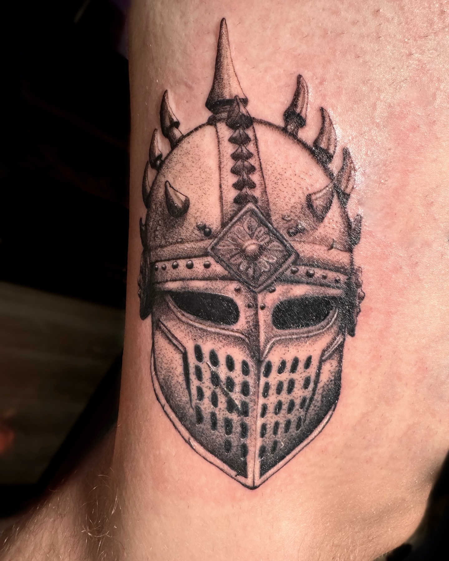 Viking helmet black and grey tattoo on the forearm by Tattoo Artist ⚔️ San Diego, CA