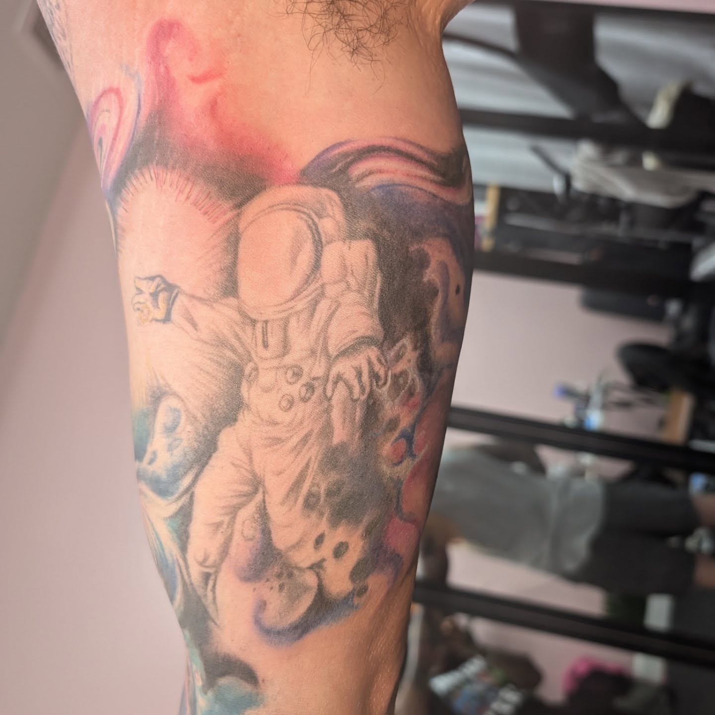 Astronaut realism tattoo on the forearm by Markus Hicks