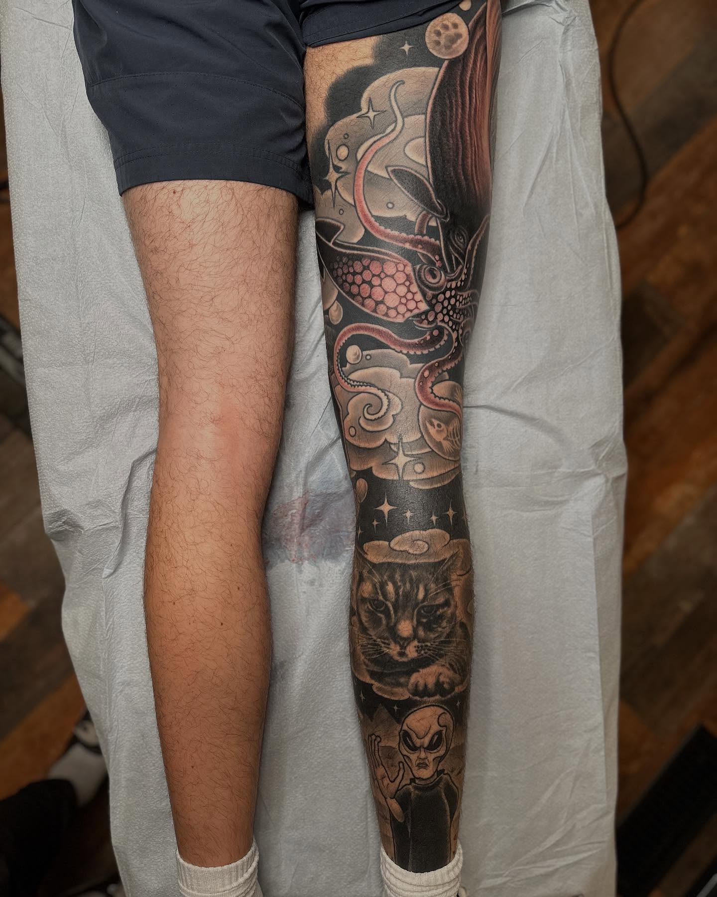 Cat and alien dotwork tattoo on the leg by Megon Shore, Seattle, Washington