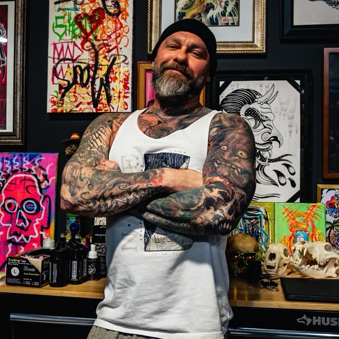 Tattooed man American traditional tattoo on the torso by John Black