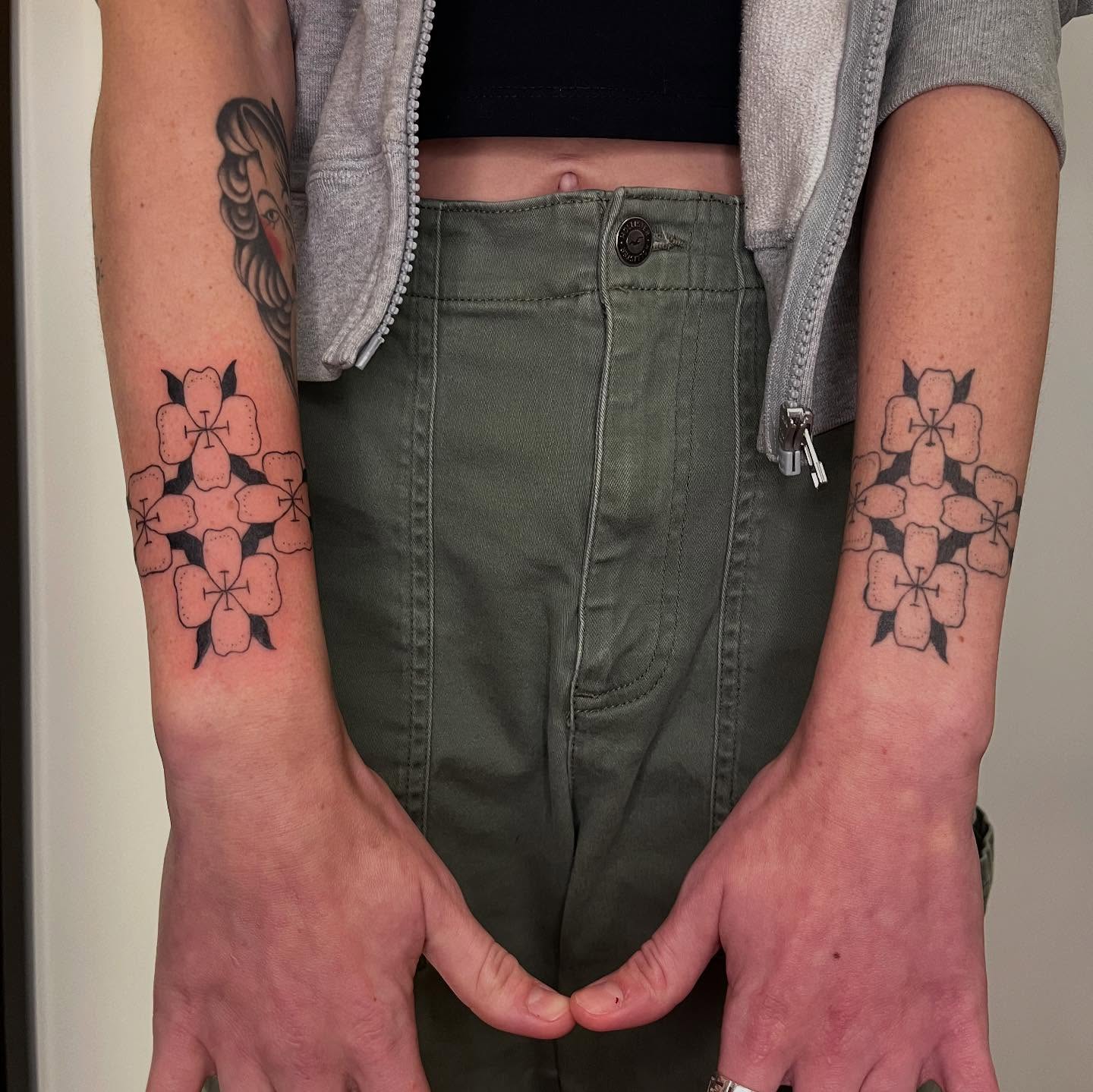 Cherry blossoms geometric tattoo on the forearm by Emily Rose Lumsdaine