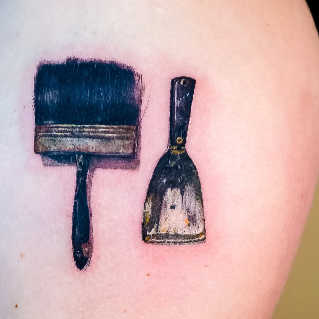 Paint brush and scraper minimalist tattoo on the shoulder by NAS