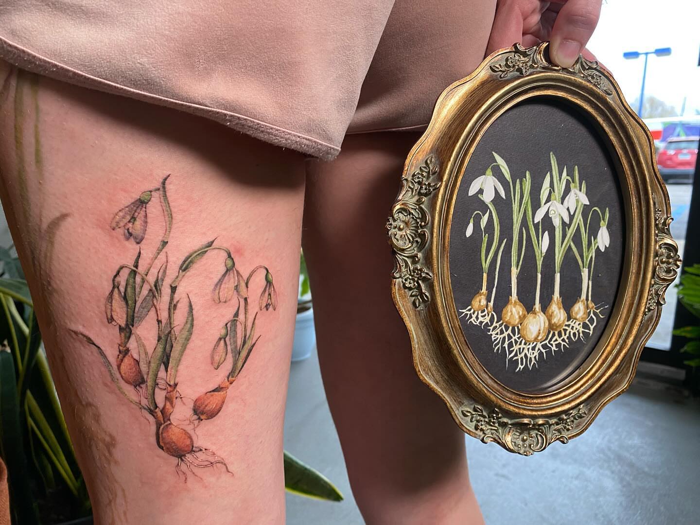 Snowdrops realism tattoo on the thigh by Amber Miracle