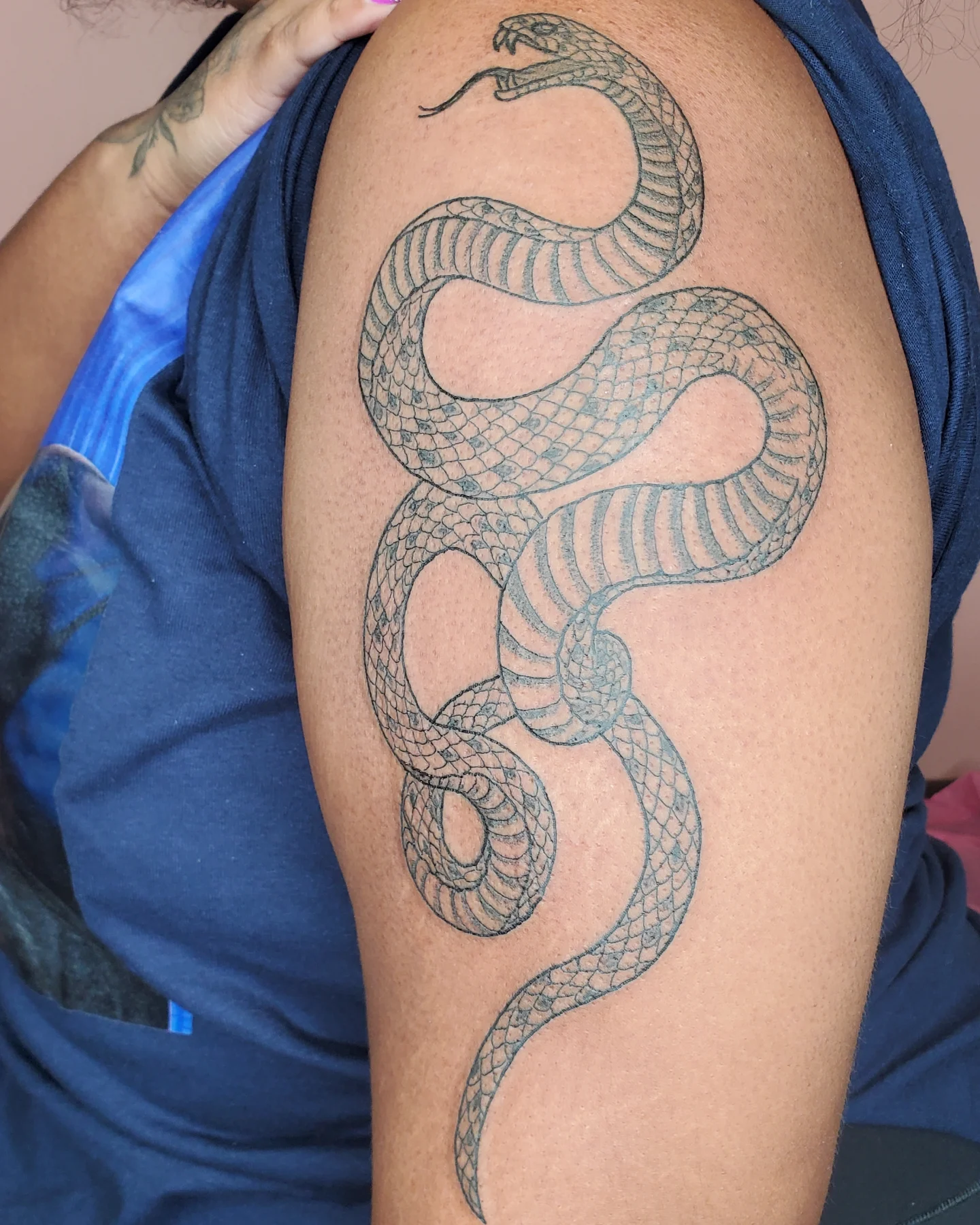 Snake black and grey tattoo on the shoulder by Sum'er Daize Tattoos