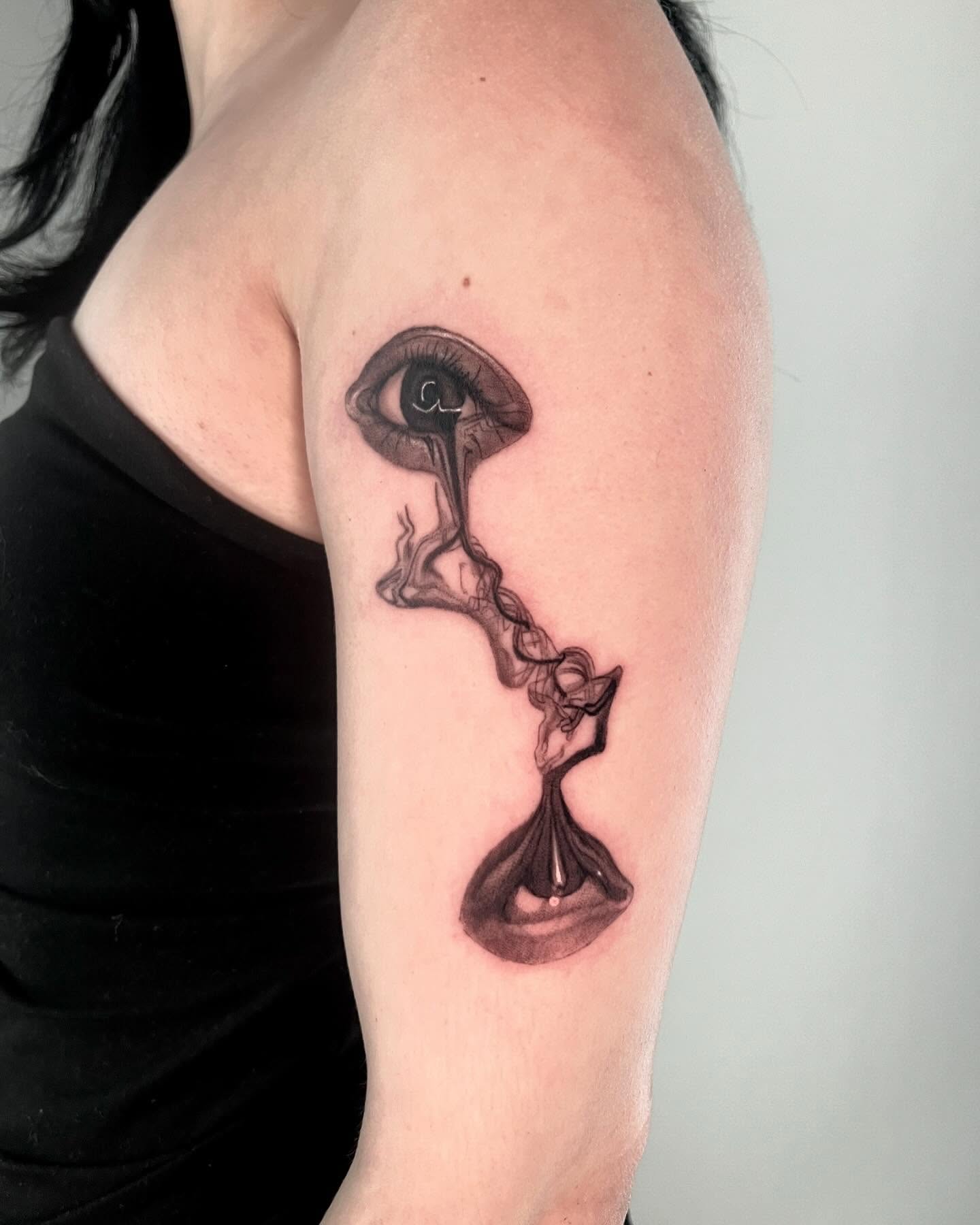 Hourglass with eye surrealism tattoo on the forearm by Anthony “Jiinky” Quintanilla 🧸☁️