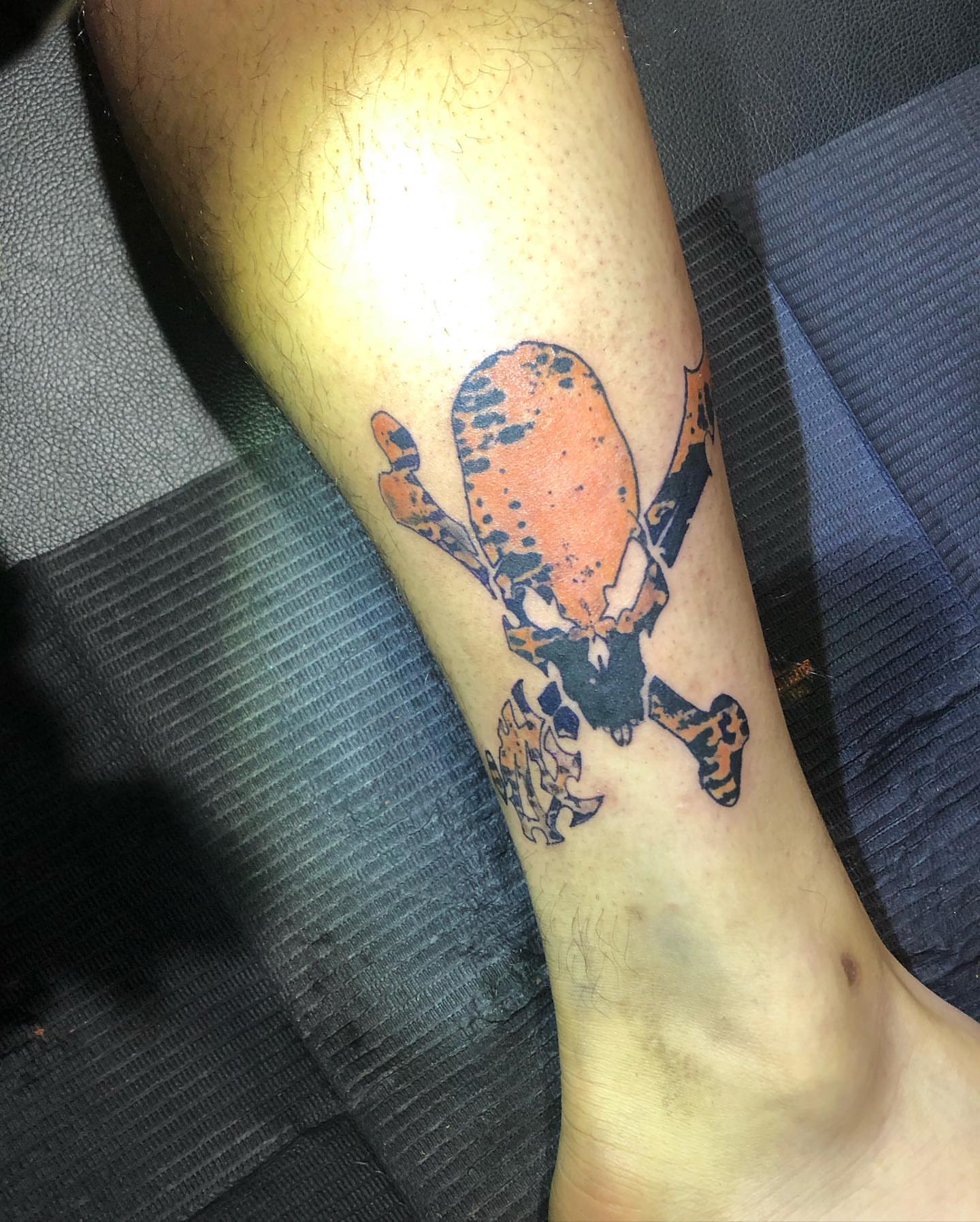 Skull and crossbones American traditional tattoo on the forearm by @emotionalthugtattoo