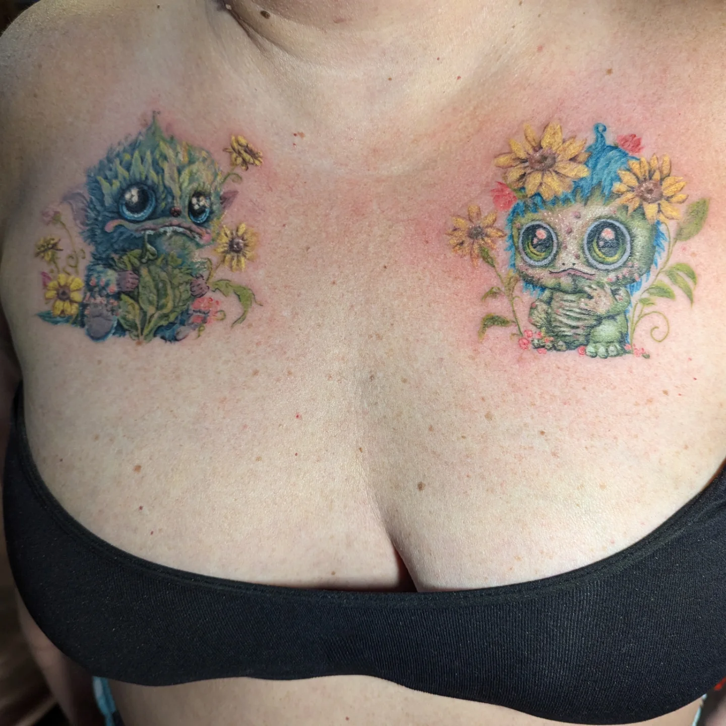 Monster with flowers illustrative tattoo on the chest by Cat