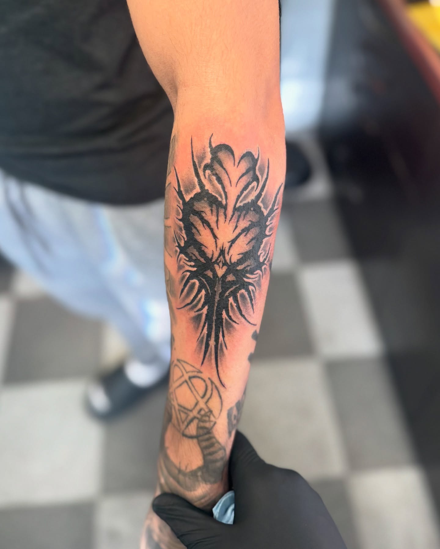 Floral black and grey tattoo on the forearm by Brandon Seven