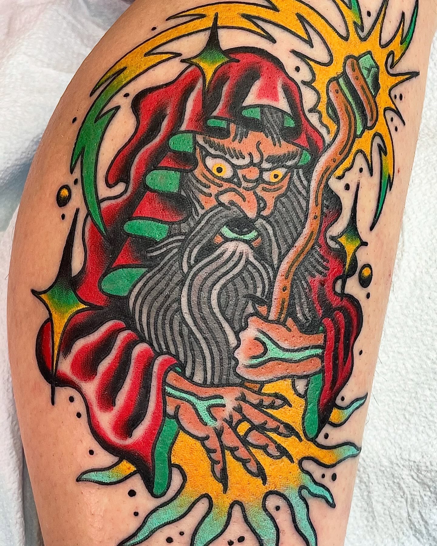 Bearded figure American traditional tattoo on the thigh by Frank Mostek