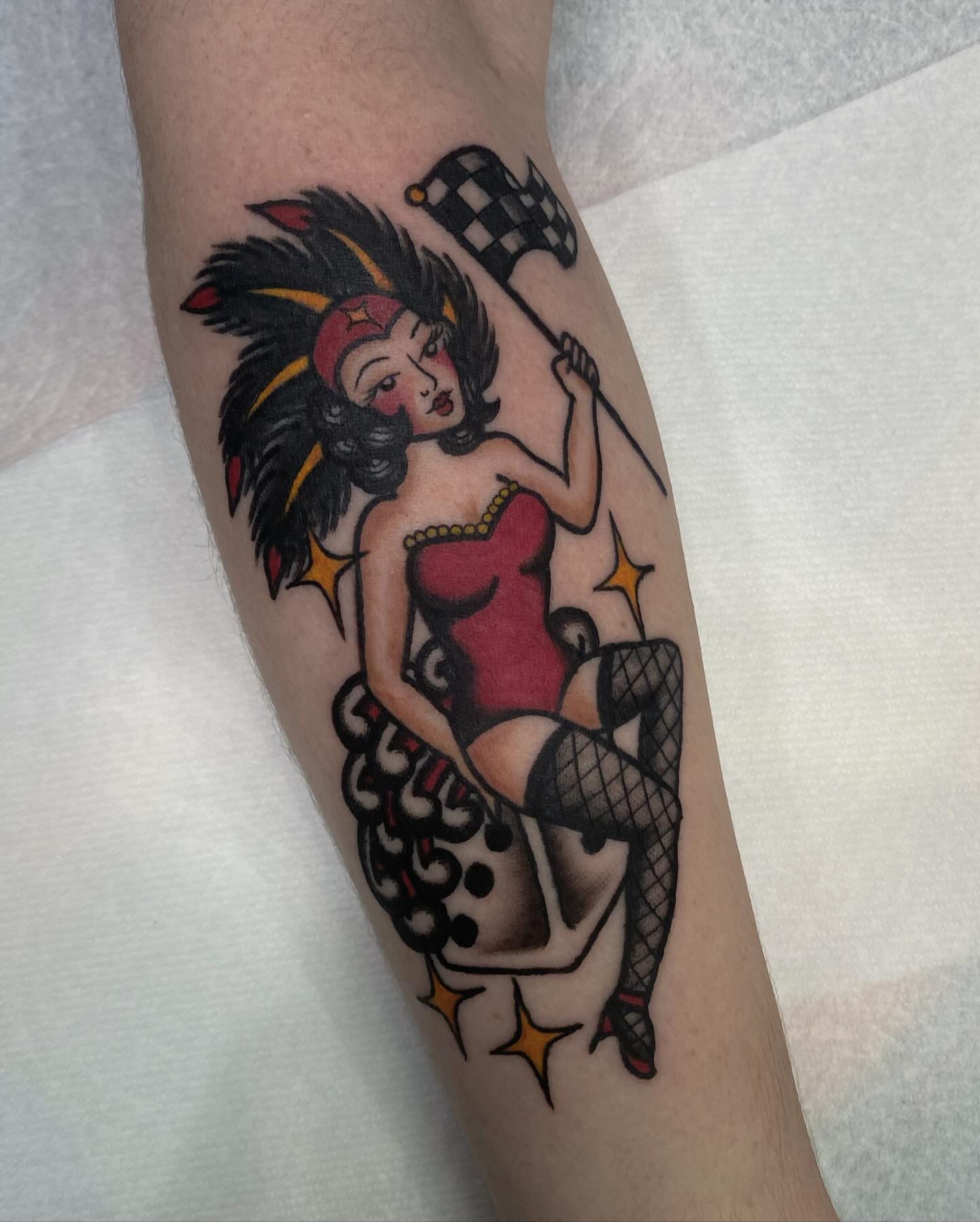 Pin-up girl American traditional tattoo on the forearm by Lindsey Cam Van