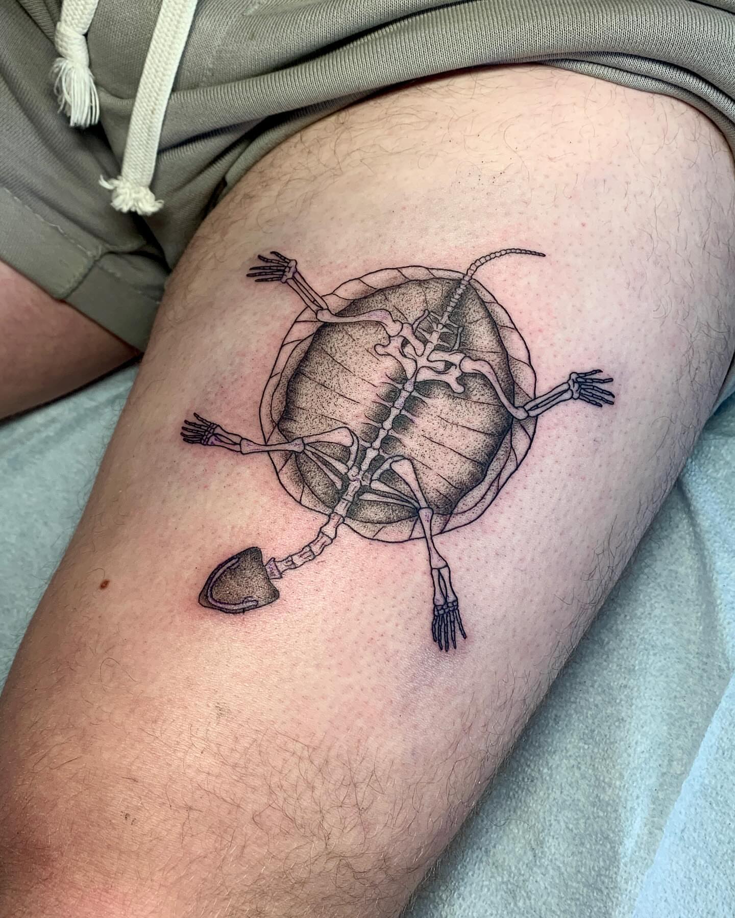 Skeleton black and grey tattoo on the thigh by ⓣⓞⓡⓘ, Bangor, Maine