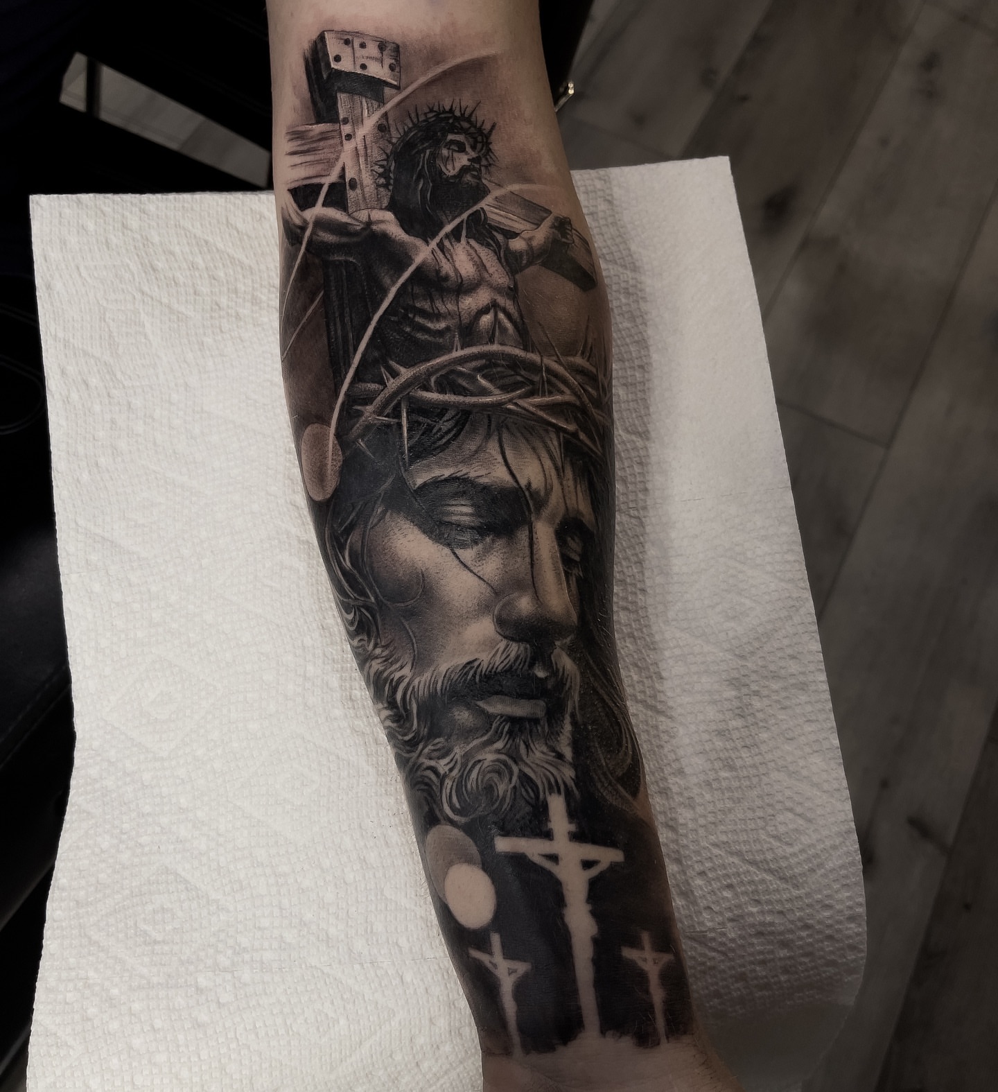 Religious imagery realism tattoo on the forearm by Andy