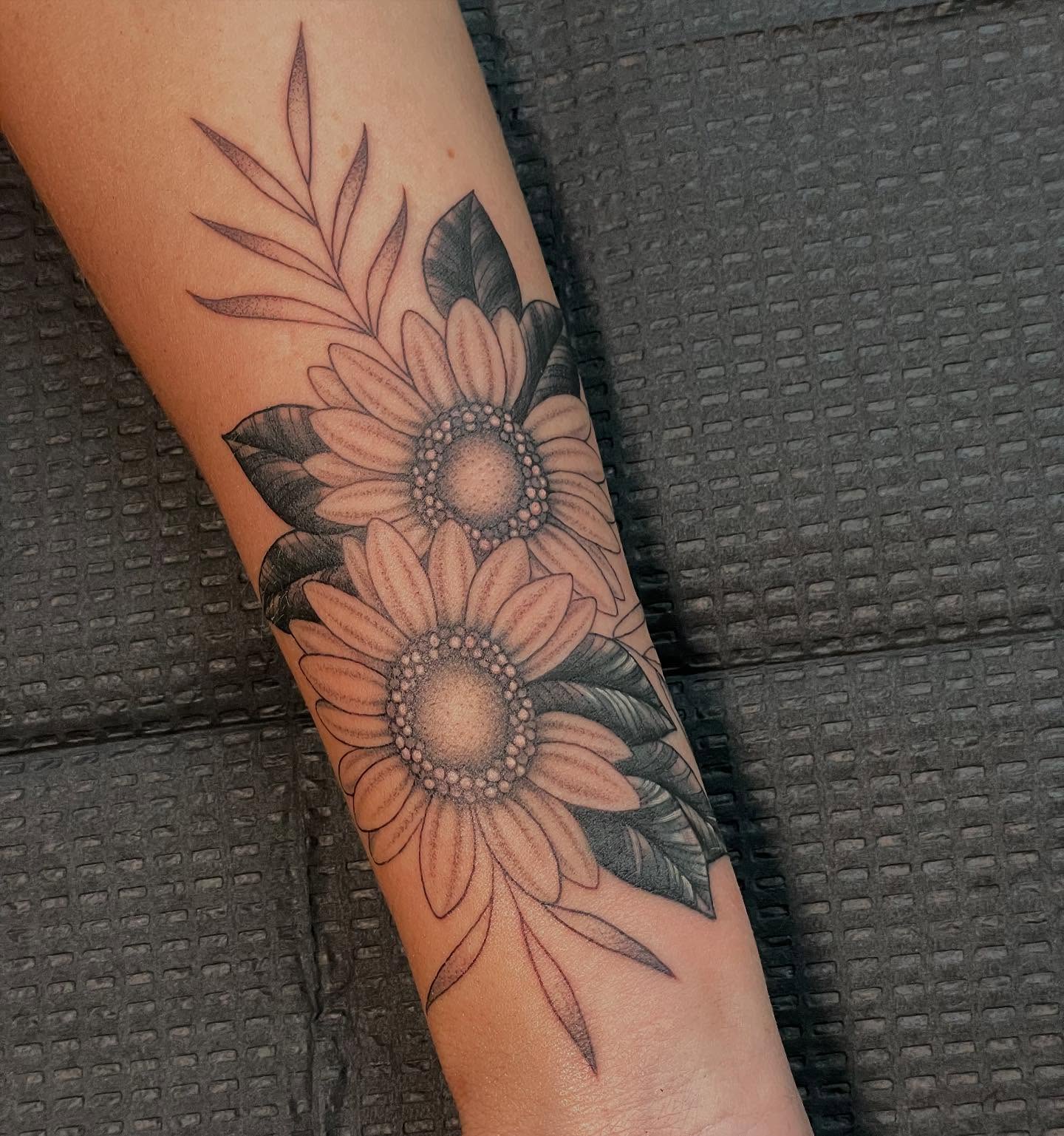 Sunflowers dotwork tattoo on the forearm by Candence Smith