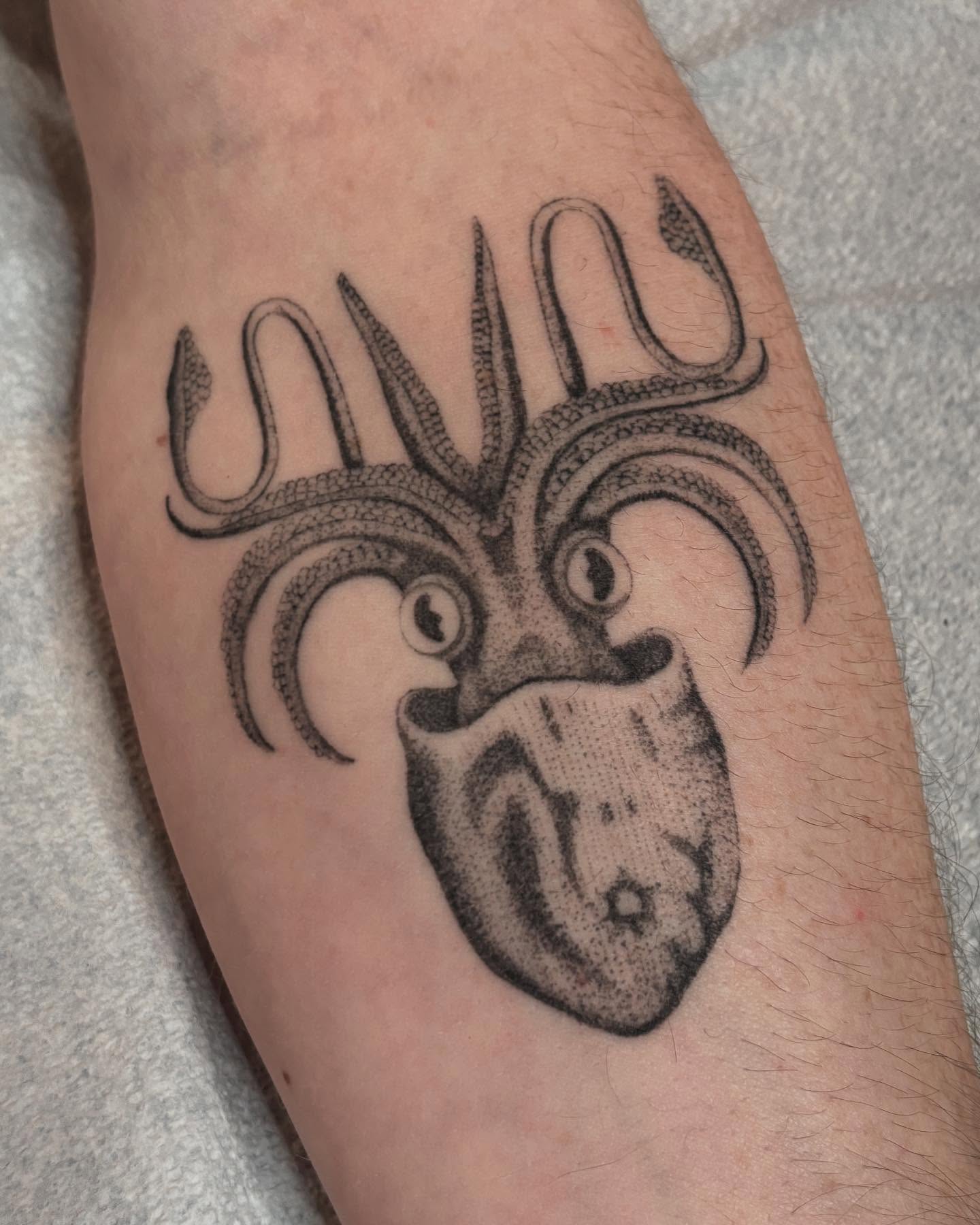 Heart with tentacles dotwork tattoo on the forearm by Jake Hodson, Nashville, Tennessee