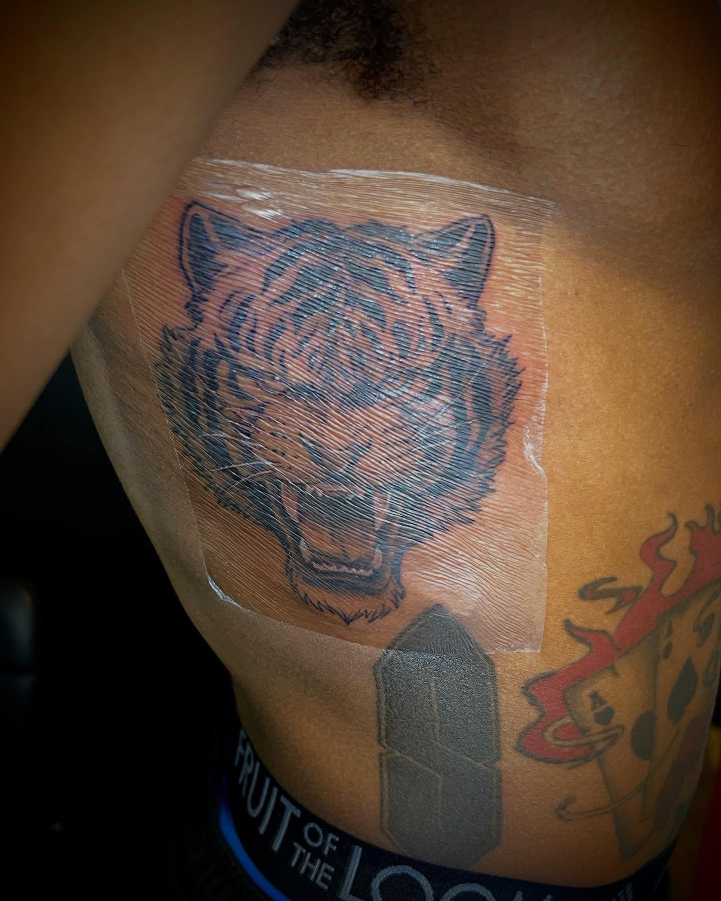 Tiger American traditional tattoo on the shoulder by Avi, Cleveland, Ohio