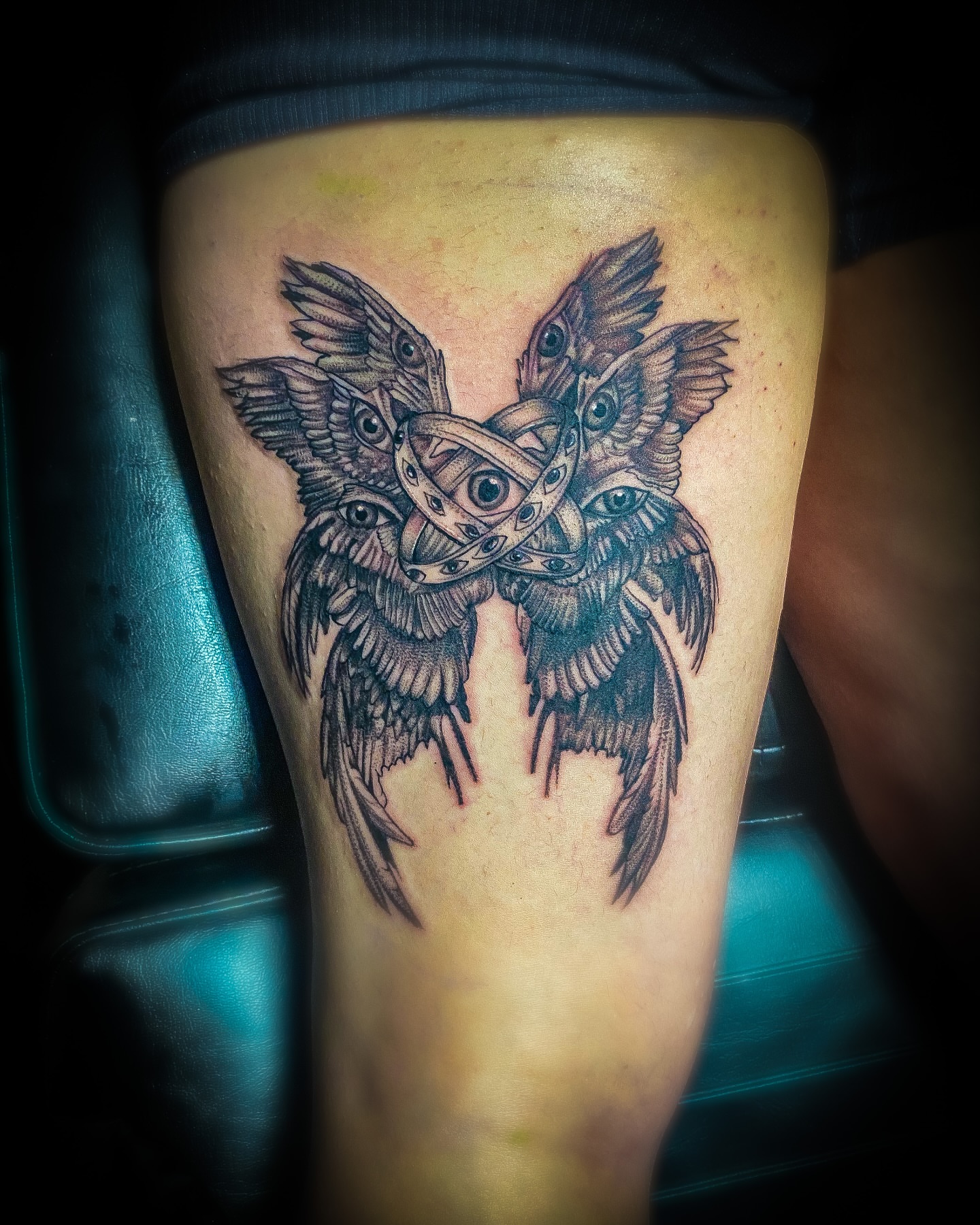 Butterfly geometric tattoo on the thigh by Rico Rosario