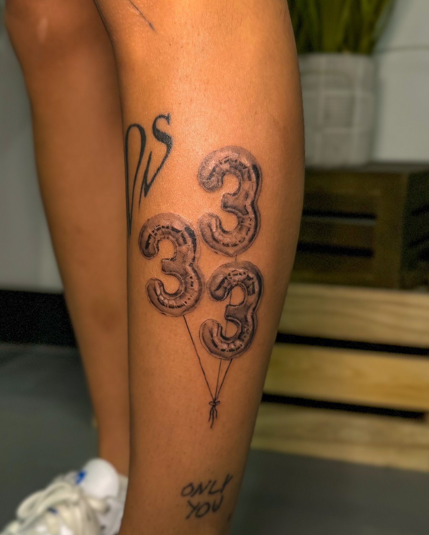 Number balloons black and grey tattoo on the leg by Rose