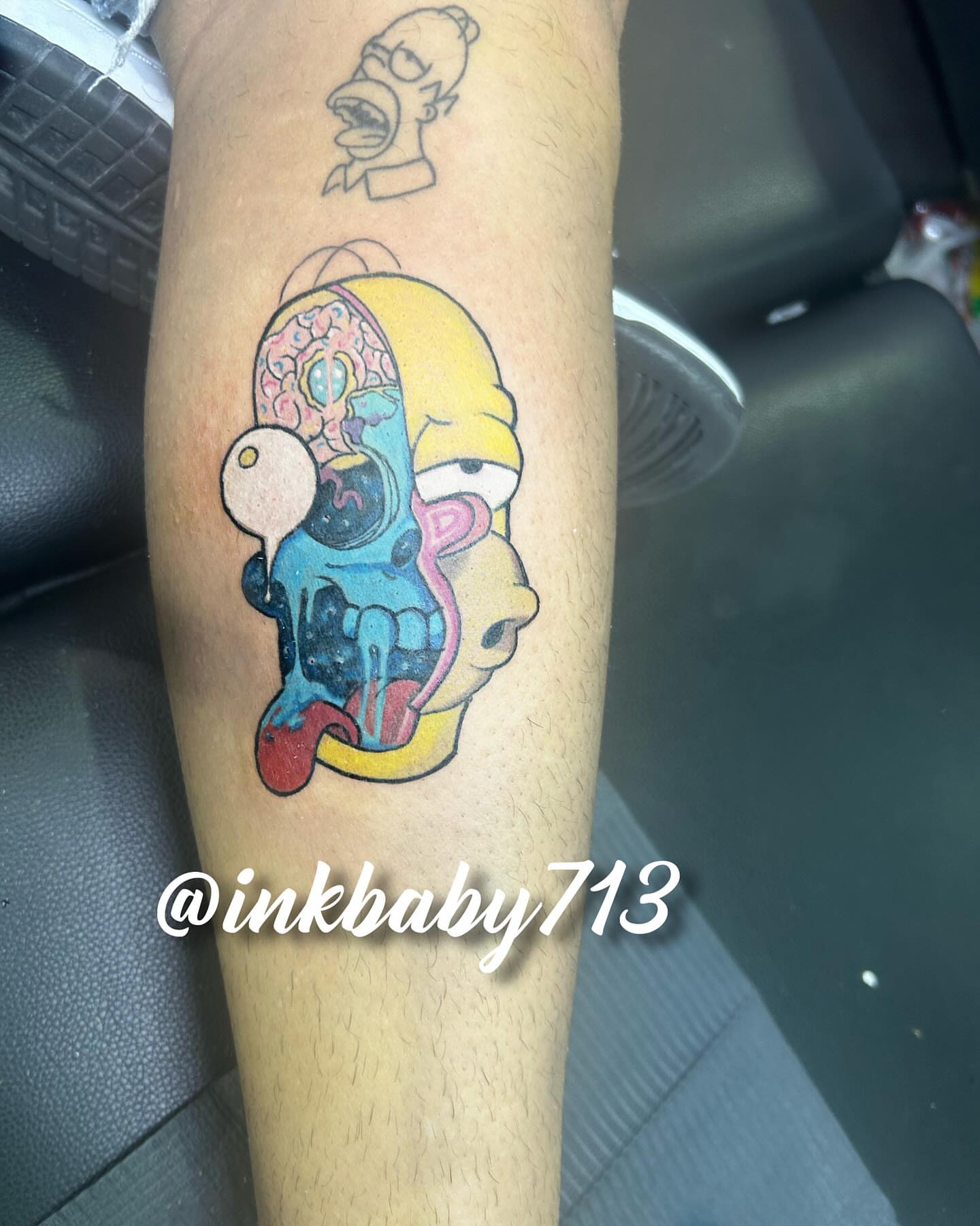 Homer Simpson new school tattoo on the forearm by Ayanna Luna