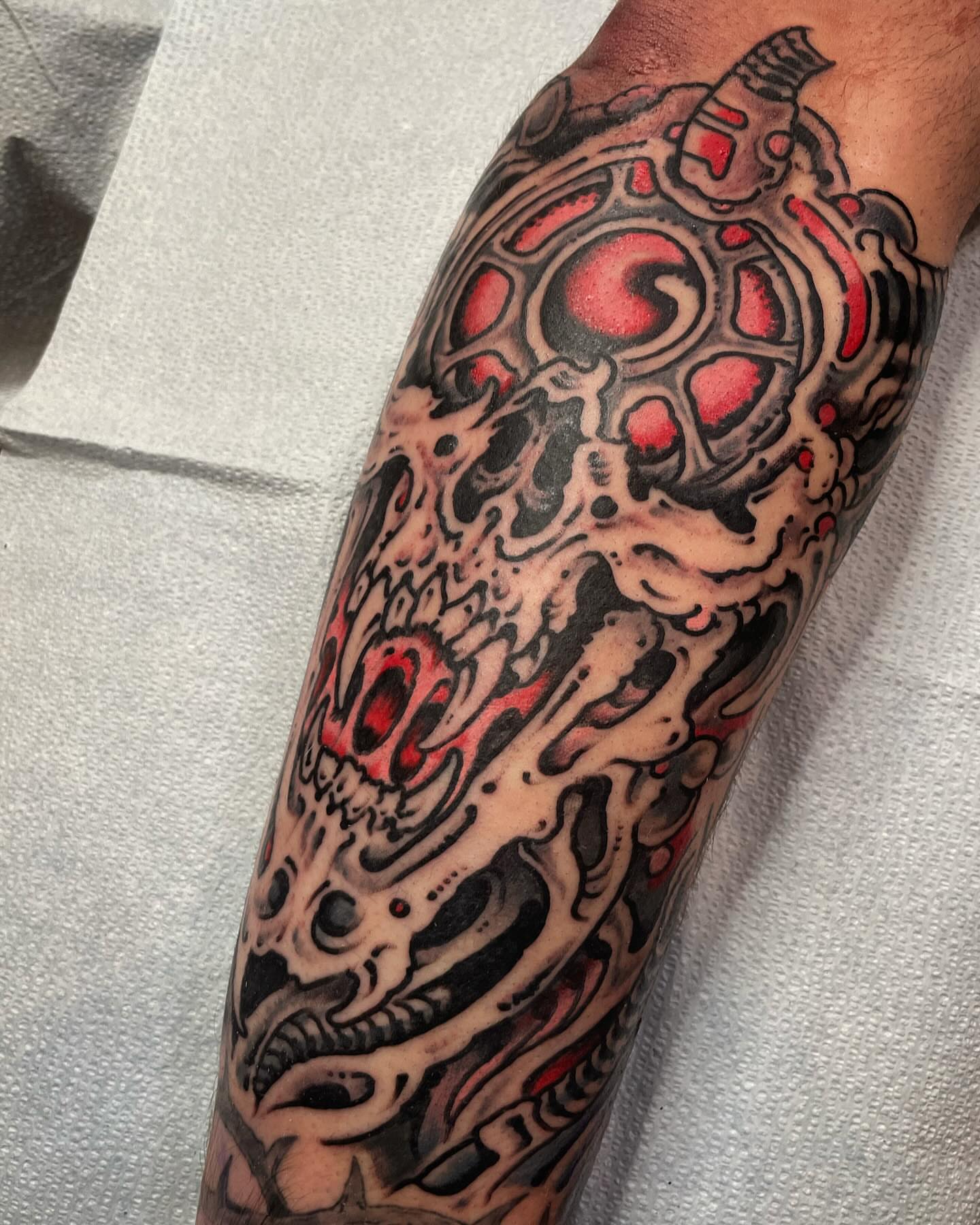Cyborg skull geometric tattoo on the forearm by Zac Blevins
