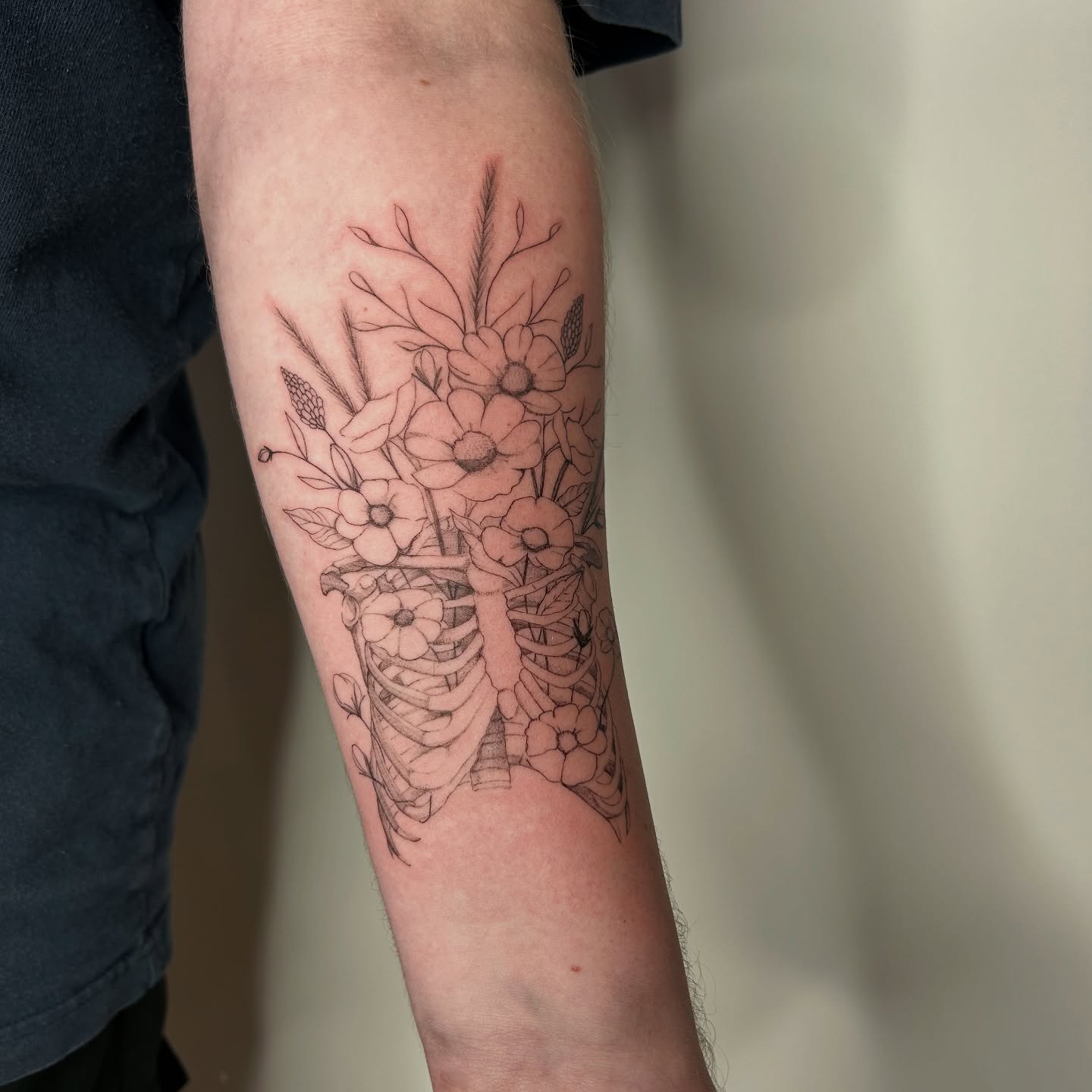 Flower bouquet black and grey tattoo on the forearm by bre