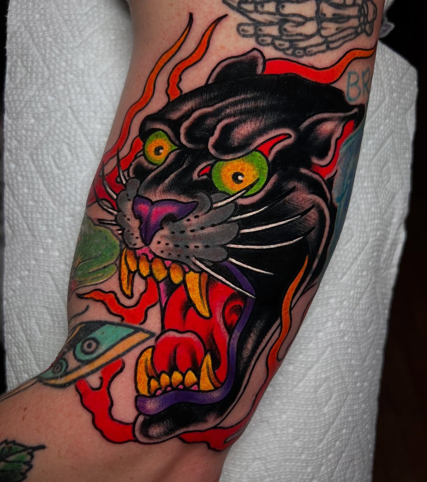 Panther American traditional tattoo on the forearm by Barron