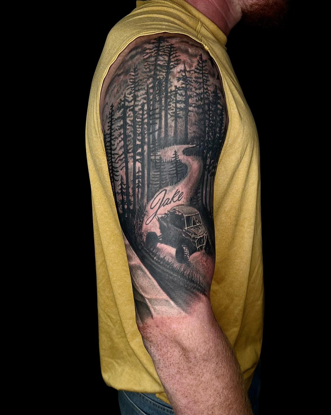 Forest scene black and grey tattoo on the forearm by James Reed Tattoo artist