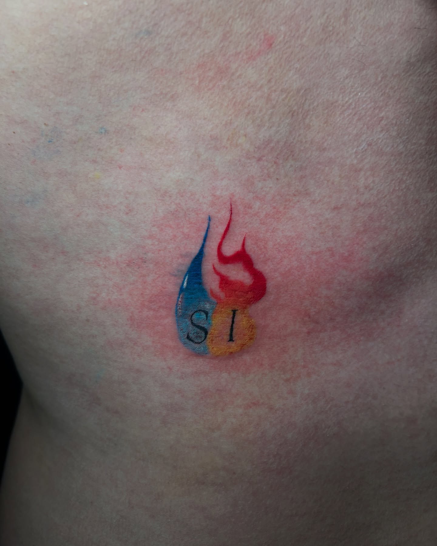 Flame and water dotwork tattoo on the chest by Lucas Garcia - New York tattoo artist