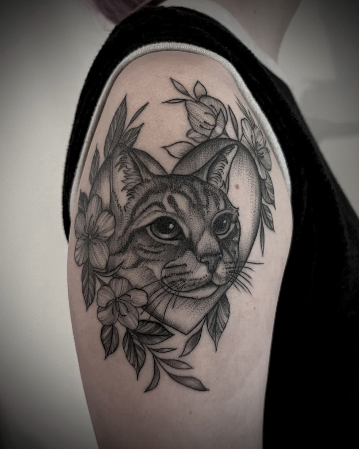 Cat dotwork tattoo on the shoulder by Kat Ackerman